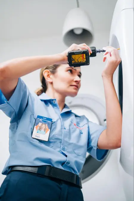 mr. appliance professional working on dryer